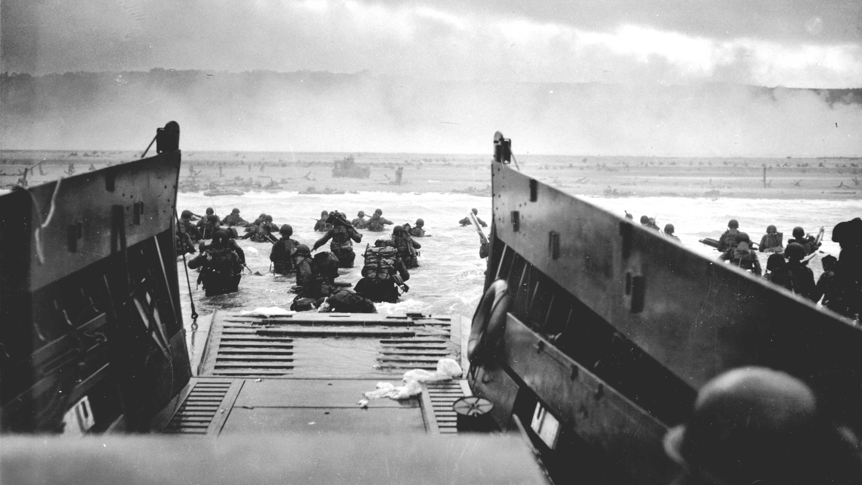 Allied troops wading ashore from a landing craft on D-Day